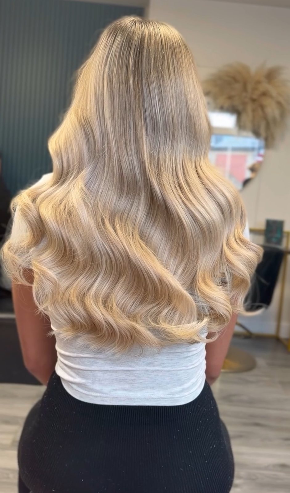Long blonde hair extensions fitted at ELM Hair and Beauty in Wrexham