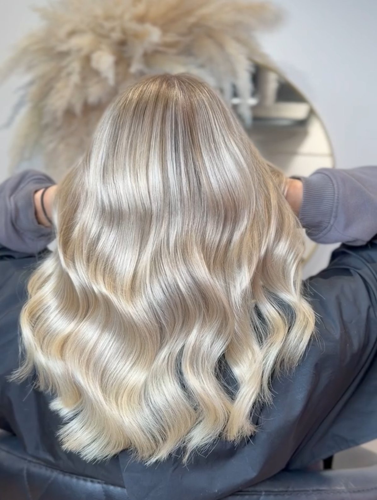 Creamy blonde highlights styled in waves at ELM Hair and Beauty, Wrexham