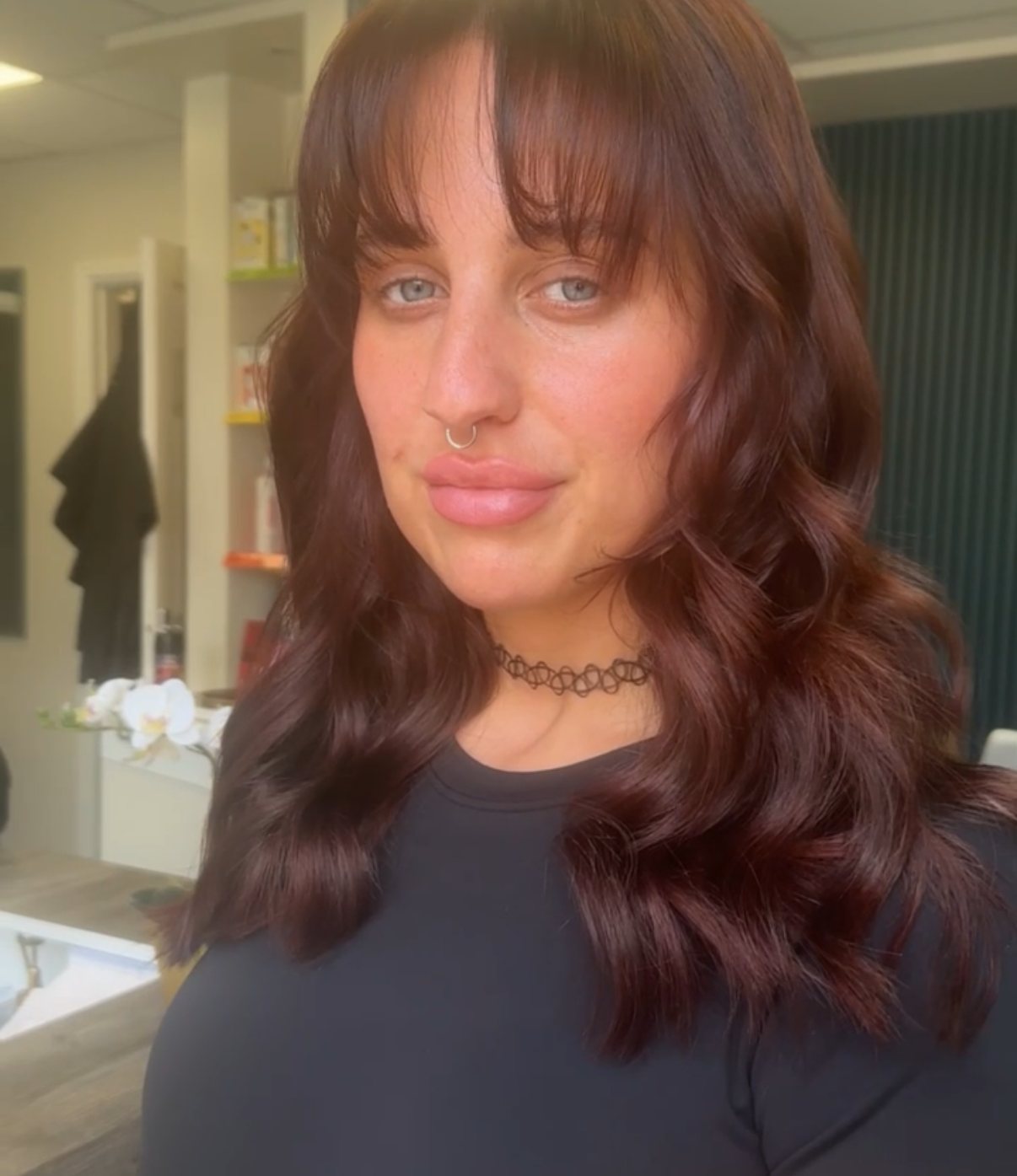 Deep burgundy hair colour with a fringe at ELM Hair and Beauty, Wrexham
