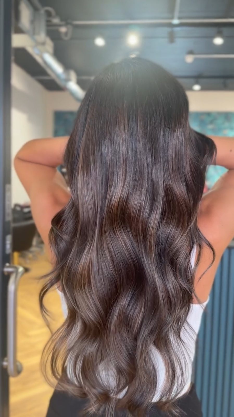 Subtle caramel balayage on dark brunette hair at ELM Hair and Beauty, Wrexham