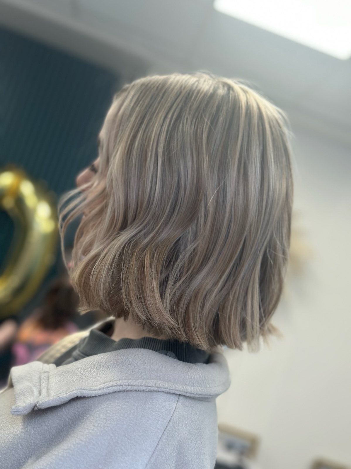 Silver blonde bob haircut with soft waves at ELM Hair and Beauty, Wrexham
